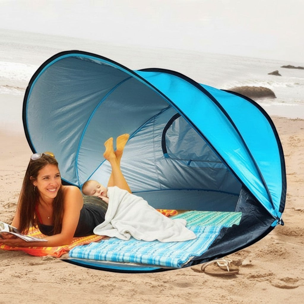 ZenZon Nordic blue pop-up beach tent with UV protection, waterproof, and sandbags. Woman relaxing inside.