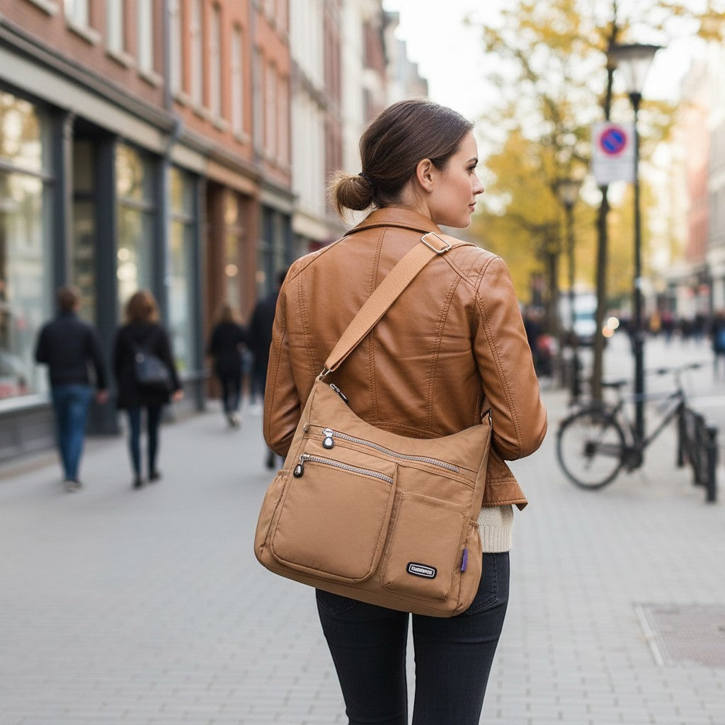 ZenZon Nordic beige nylon crossbody bag with multiple zipper pockets worn by a woman on a city street