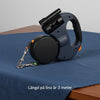ZenZon Nordic blue retractable dual dog leash with built-in LED flashlight and waste bag holder on a blue cloth
